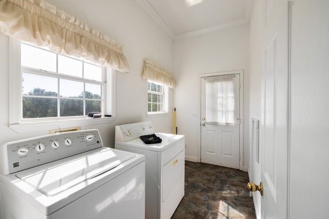 washroom with ornamental molding and washing machine and clothes dryer