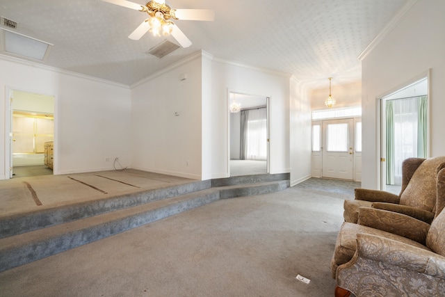 living room featuring ceiling fan, carpet flooring, and ornamental molding