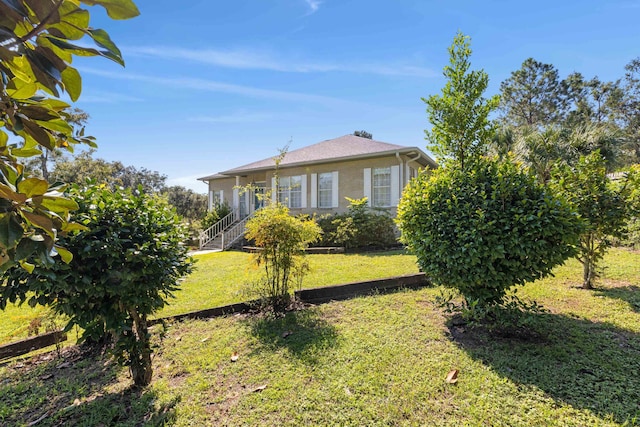 exterior space featuring a front yard