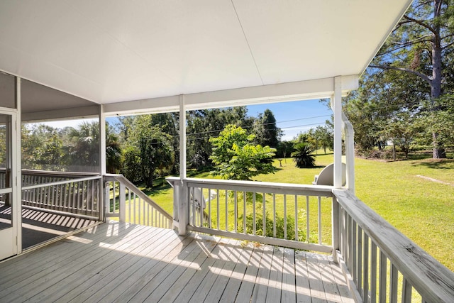 wooden deck with a lawn