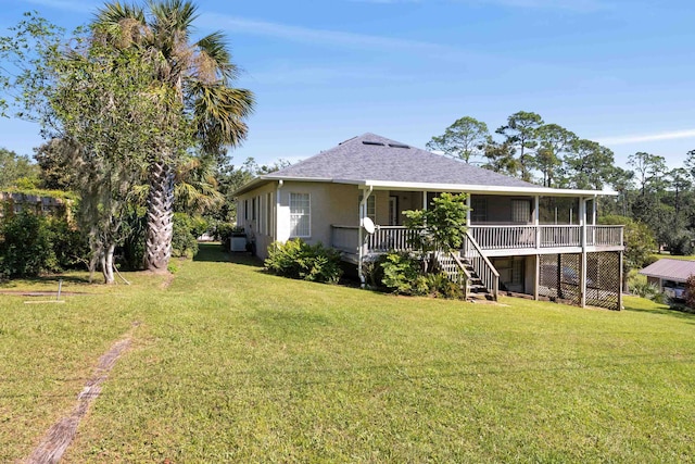 back of property featuring a lawn