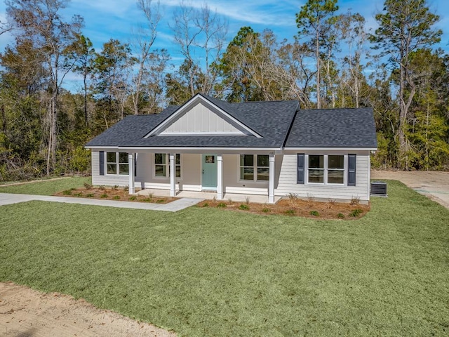 view of front of property with a front yard and covered porch