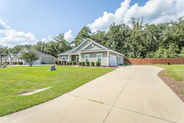 view of front facade featuring a garage and a front yard