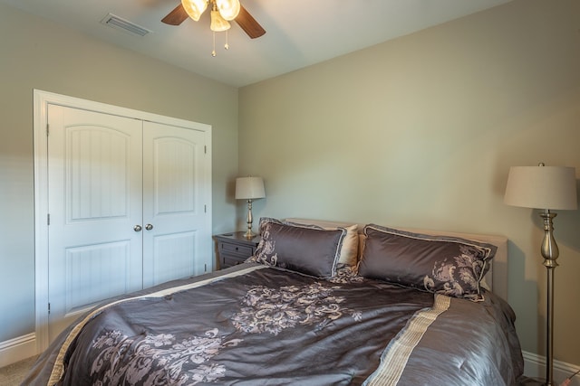 bedroom featuring ceiling fan and a closet