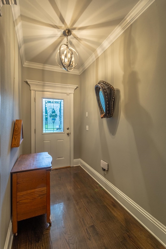 entryway with a chandelier, crown molding, and dark hardwood / wood-style flooring