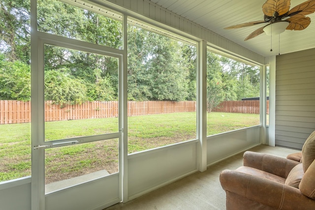 sunroom featuring a wealth of natural light and ceiling fan