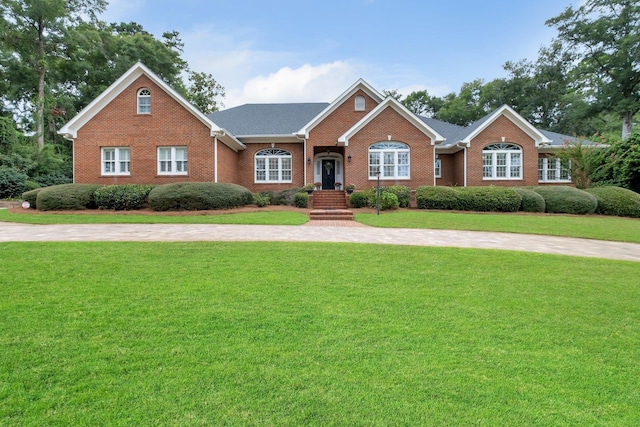 ranch-style home with a front lawn