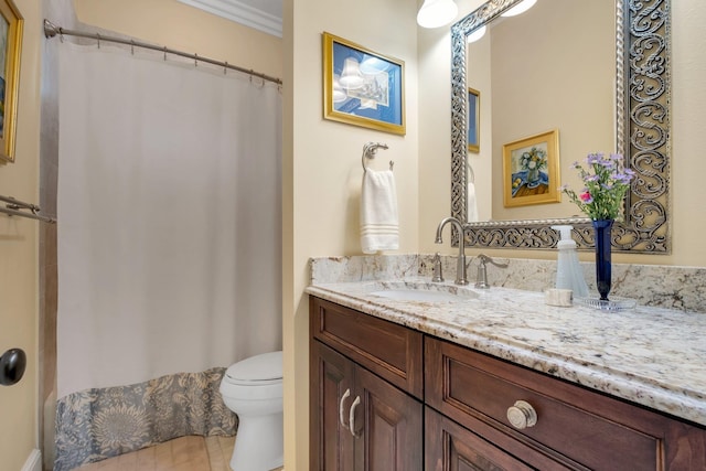 bathroom with vanity, tile patterned flooring, and toilet