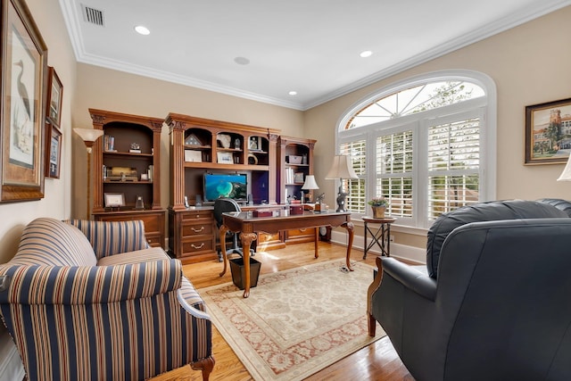 office space with light hardwood / wood-style flooring and ornamental molding