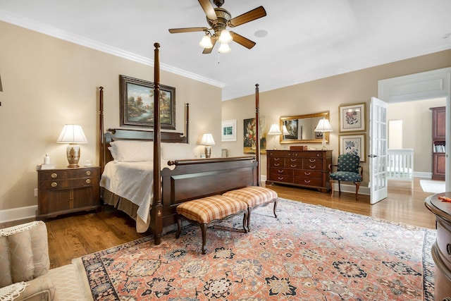 bedroom with ornamental molding and light wood-type flooring