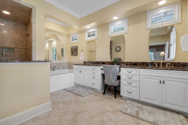 bathroom with tile patterned flooring, vanity, ornamental molding, and shower with separate bathtub