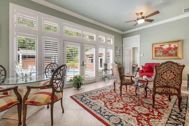 dining room with light tile patterned flooring, ornamental molding, ceiling fan, and french doors