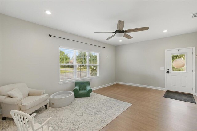 604 Judson Dr, Perry, FL 32348 - living area with wood finished floors, ceiling fan, recessed lighting, and baseboards