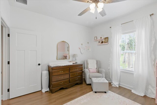604 Judson Dr, Perry, FL 32348 - sitting room featuring wood finished floors, a ceiling fan, and baseboards