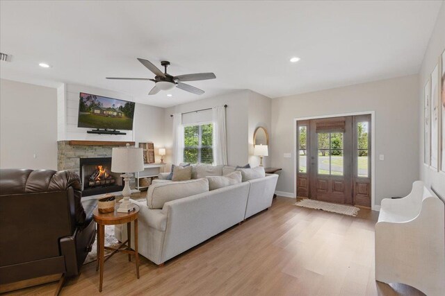 604 Judson Dr, Perry, FL 32348 - living room featuring light wood-style floors, a fireplace, a ceiling fan, recessed lighting, and baseboards