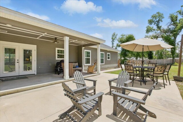 604 Judson Dr, Perry, FL 32348 - view of patio with french doors and outdoor dining area