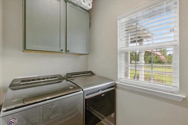 604 Judson Dr, Perry, FL 32348 - washroom with cabinet space and washing machine and clothes dryer