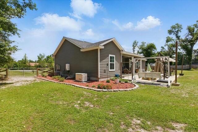 604 Judson Dr, Perry, FL 32348 - view of side of home with a patio and central air condition unit