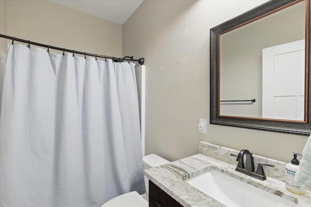 604 Judson Dr, Perry, FL 32348 - bathroom with toilet, vanity, and a shower with shower curtain