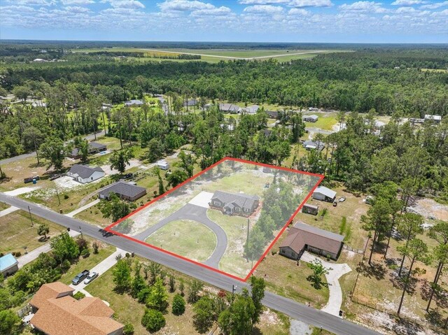 604 Judson Dr, Perry, FL 32348 - aerial overview of property's location featuring property boundaries highlighted and a heavily wooded area