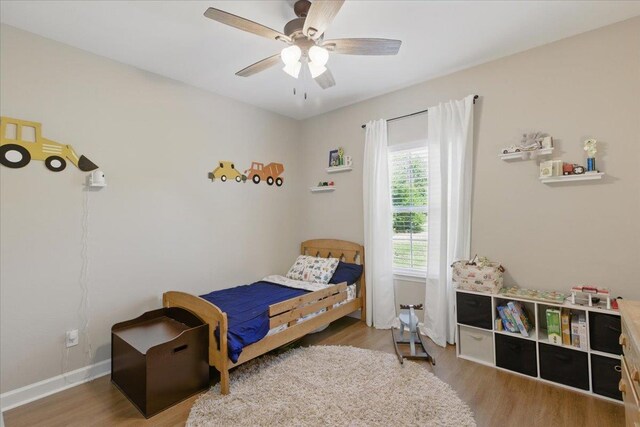 604 Judson Dr, Perry, FL 32348 - bedroom with wood finished floors, ceiling fan, and baseboards