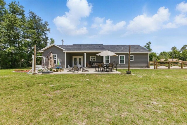 604 Judson Dr, Perry, FL 32348 - rear view of house featuring french doors, a lawn, a patio, and stairway