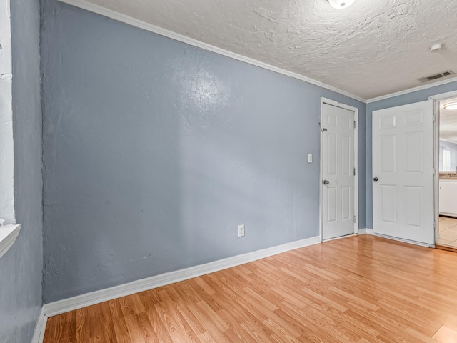 1487 Bainbridge Hwy, Quincy, FL 32352 - empty room featuring light wood-type flooring, ornamental molding, and a smoke detector