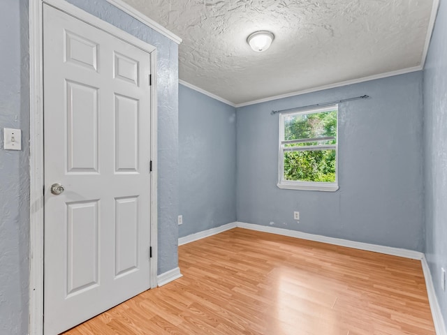 1487 Bainbridge Hwy, Quincy, FL 32352 - spare room with light wood finished floors, ornamental molding, and a textured ceiling