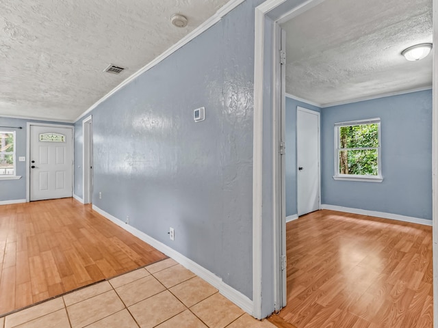 1487 Bainbridge Hwy, Quincy, FL 32352 - foyer with a textured ceiling, crown molding, and wood finished floors