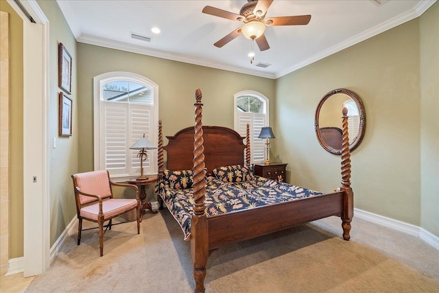 bedroom with crown molding, light colored carpet, and ceiling fan