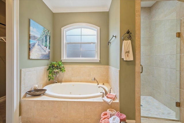 bathroom featuring ornamental molding and shower with separate bathtub