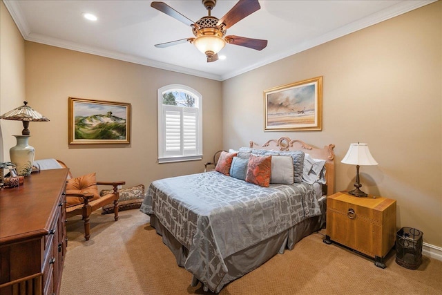 bedroom with crown molding, light colored carpet, and ceiling fan