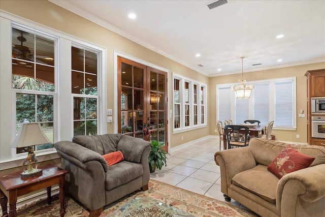 tiled living room featuring french doors and ornamental molding