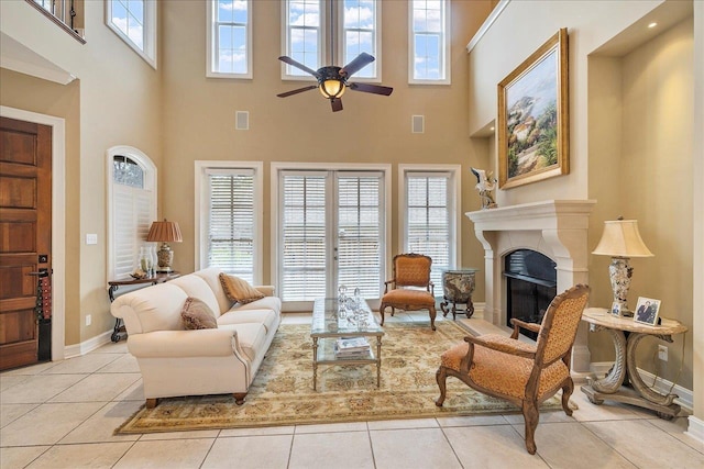 tiled living room featuring ceiling fan