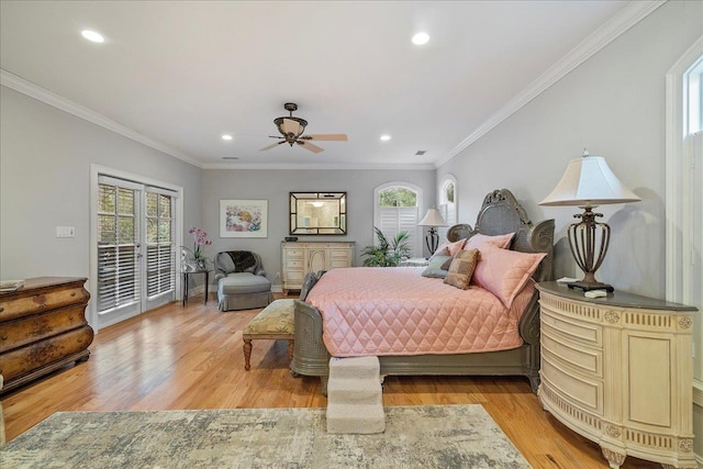 bedroom featuring access to exterior, multiple windows, and light hardwood / wood-style flooring