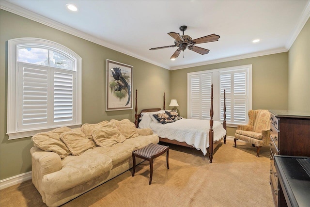 bedroom featuring crown molding, light colored carpet, and ceiling fan