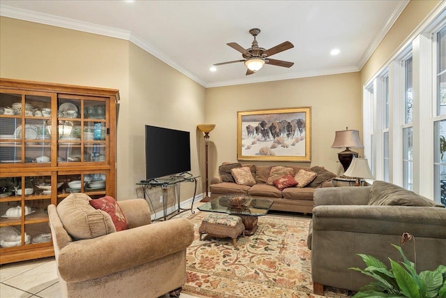 living room featuring crown molding, ceiling fan, and light tile patterned flooring