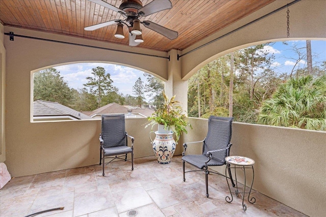 view of patio / terrace featuring a balcony and ceiling fan