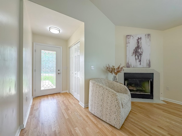 804 Medical Commons Ct, Tallahassee, FL 32310 - foyer with light wood-style flooring, a fireplace with flush hearth, and baseboards