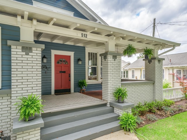 doorway to property with a porch