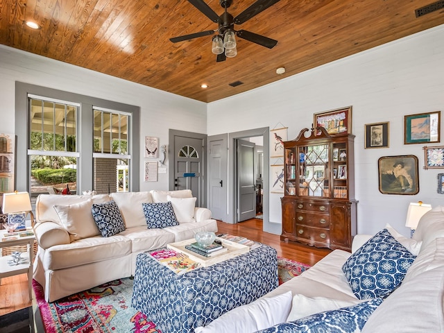 living room with hardwood / wood-style flooring, wooden ceiling, and ceiling fan