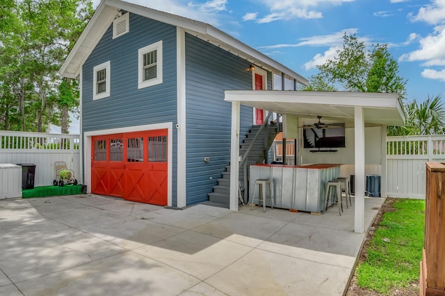 exterior space with ceiling fan