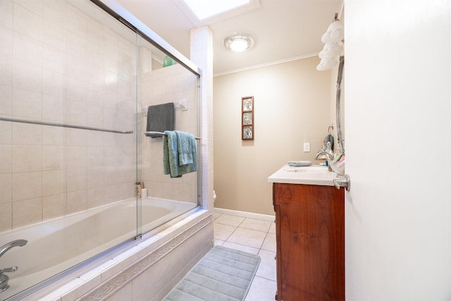 bathroom with vanity, tile patterned flooring, crown molding, and bath / shower combo with glass door