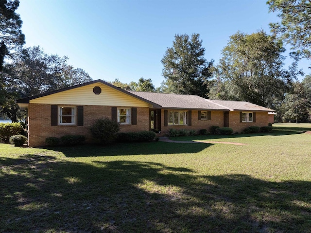 ranch-style home with a front yard