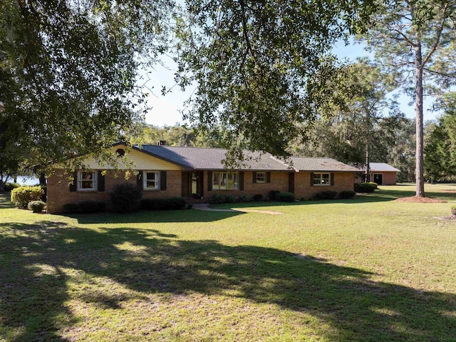 ranch-style house with a front yard