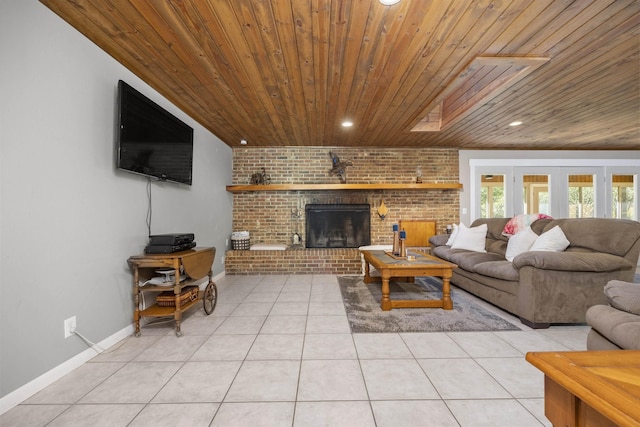 tiled living room featuring a skylight, a fireplace, brick wall, and wooden ceiling