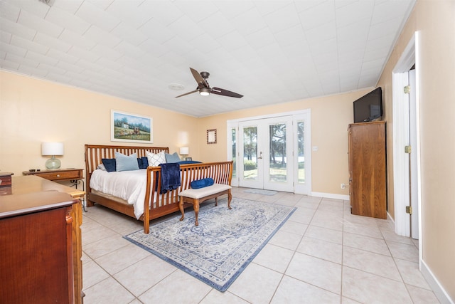 tiled bedroom with ceiling fan, access to outside, and french doors