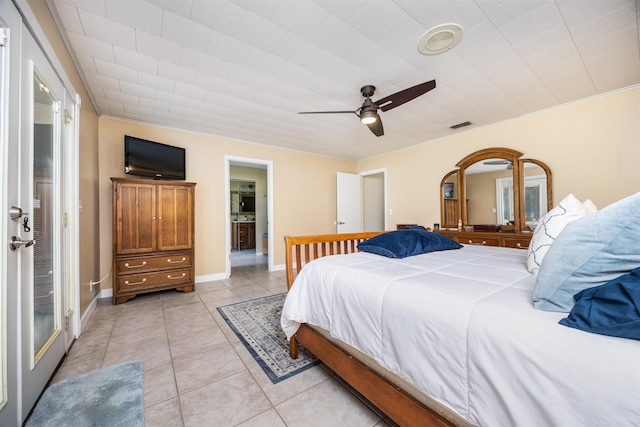 bedroom with ceiling fan and light tile patterned floors