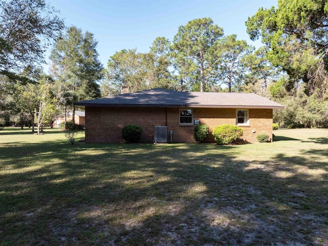 view of property exterior featuring a lawn