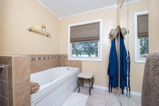 bathroom with ornamental molding, a bathing tub, and tile patterned flooring